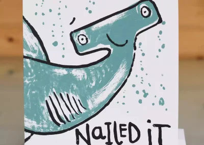 Handmade hand printed congratulations greeting card with nailed it text and hammerhead shark