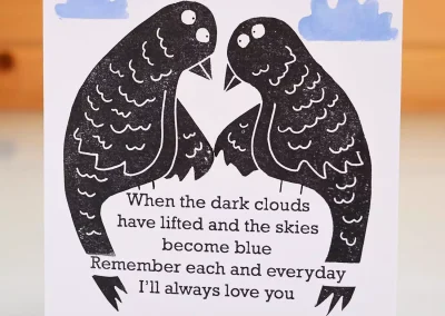 Blank inside handmade hand printed greeting card with 2 love birds and verse to say sorry but I still love you